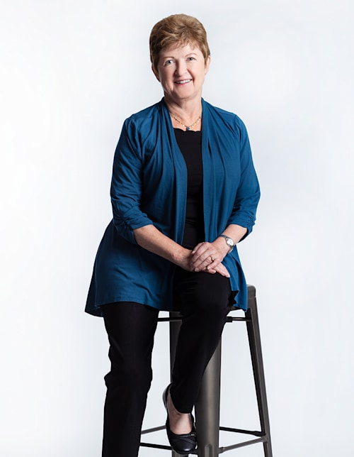 Jan Eddy sitting on a chair